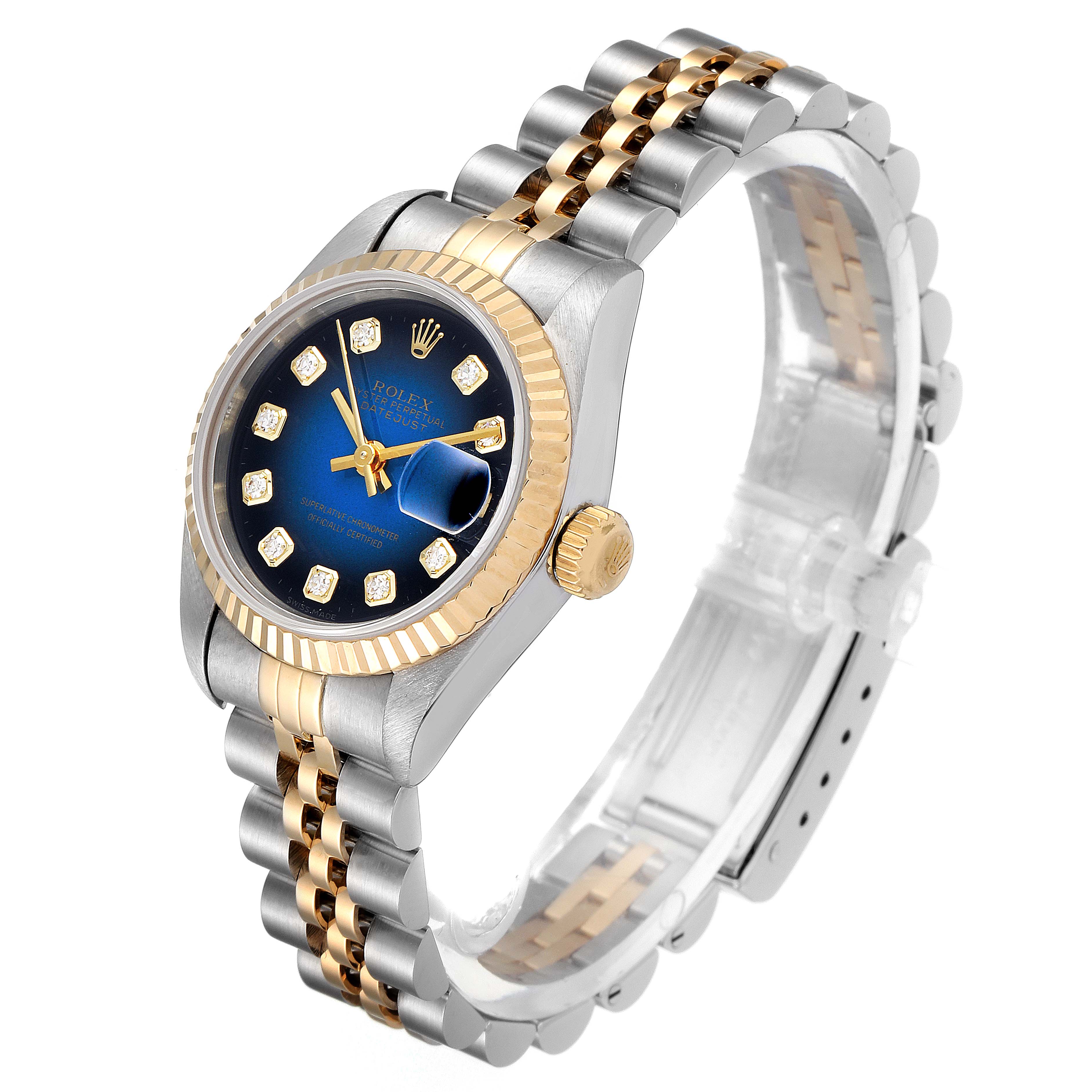 This image shows a Rolex Datejust 69173 Women's Steel and Gold (two tone) Blue Dial 69173 Women's Steel and Gold (two tone) Blue Dial watch at a three-quarter angle, revealing the blue dial, diamond markers, and bicolor bracelet.