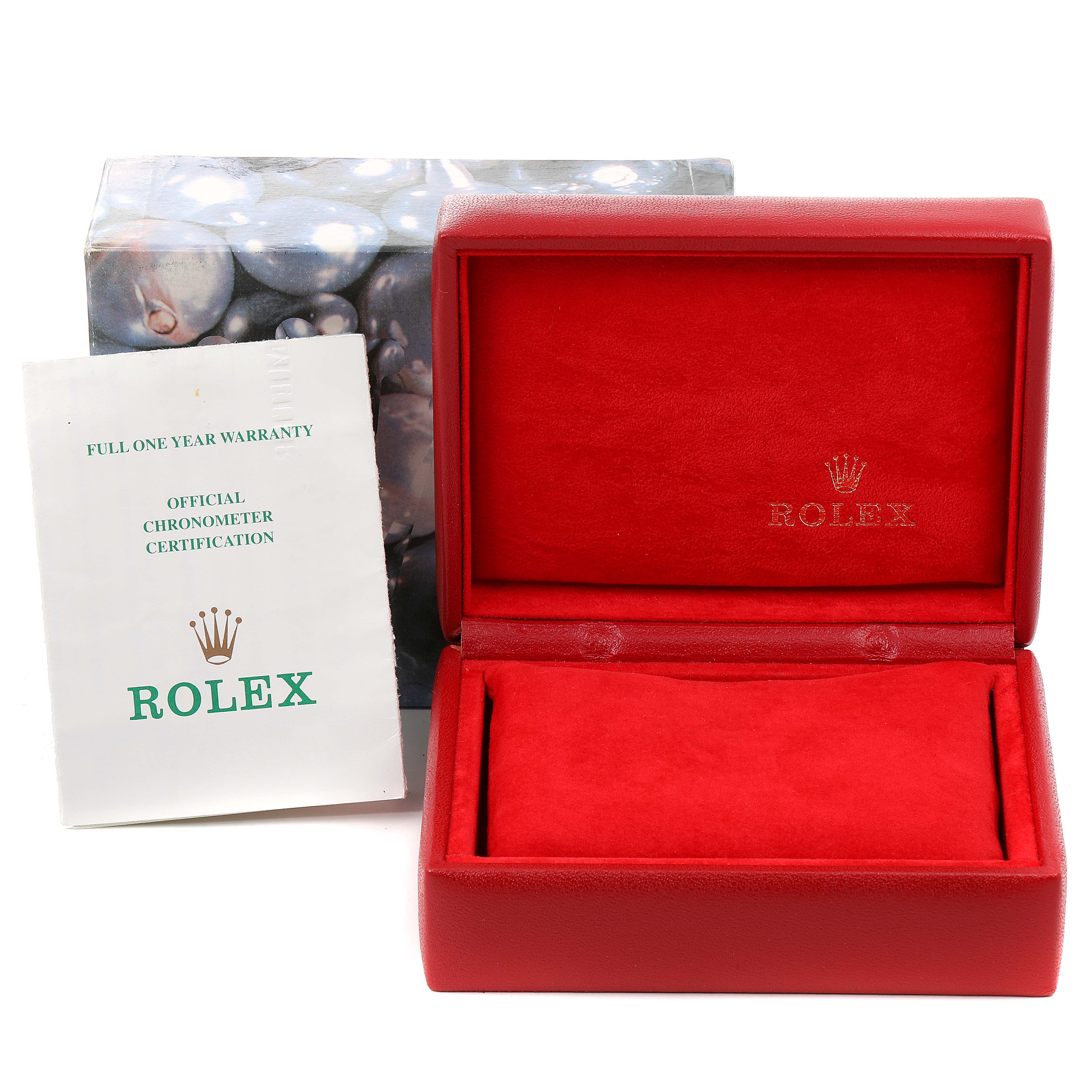 The image shows an open red Rolex box with the Rolex logo and a warranty certificate, angled from the front.