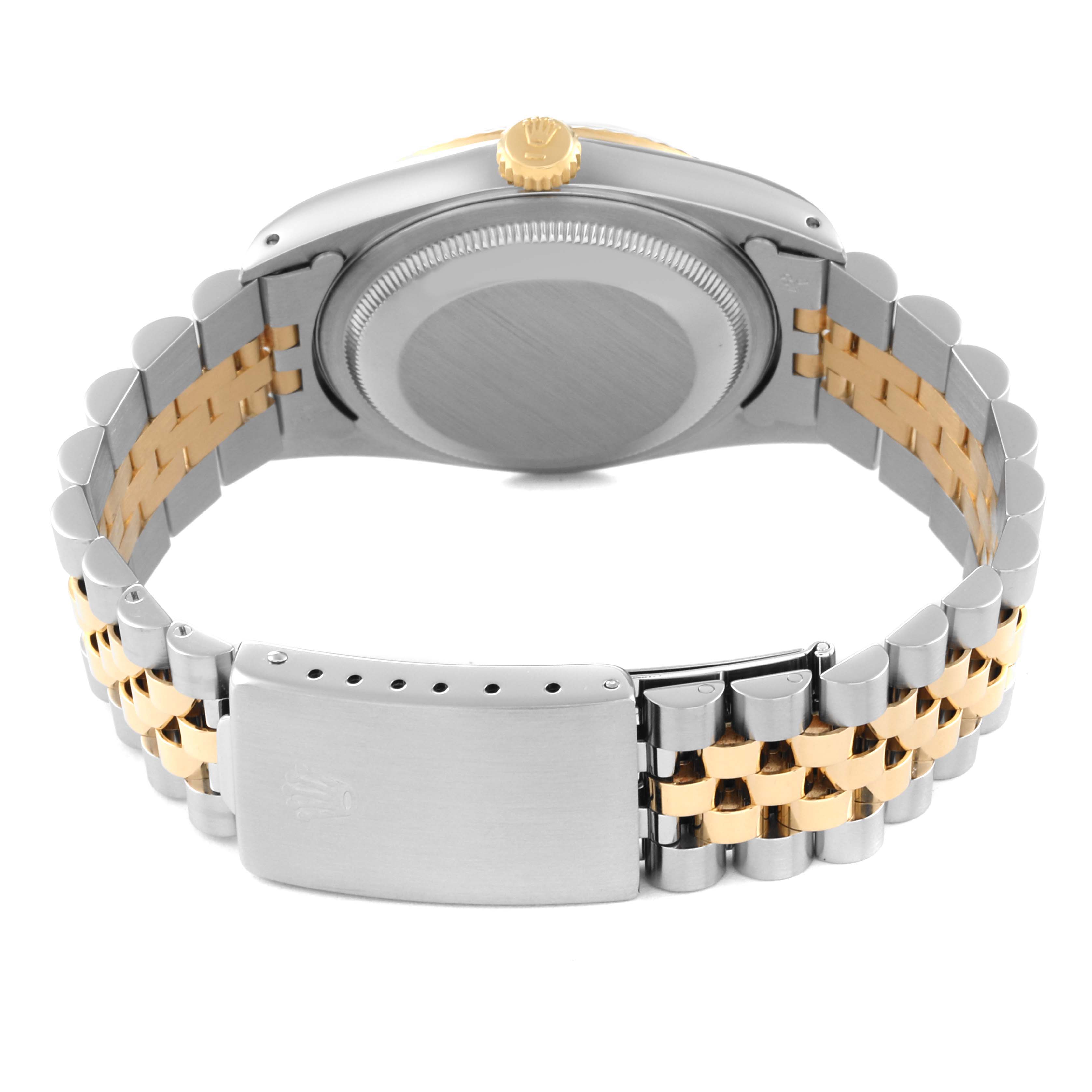 This is a rear view of a Rolex Datejust 16233 Men's Steel and Gold (two tone) Champagne Dial 16233 Men's Steel and Gold (two tone) Champagne Dial watch showing the case back, crown, and two-tone Jubilee bracelet.