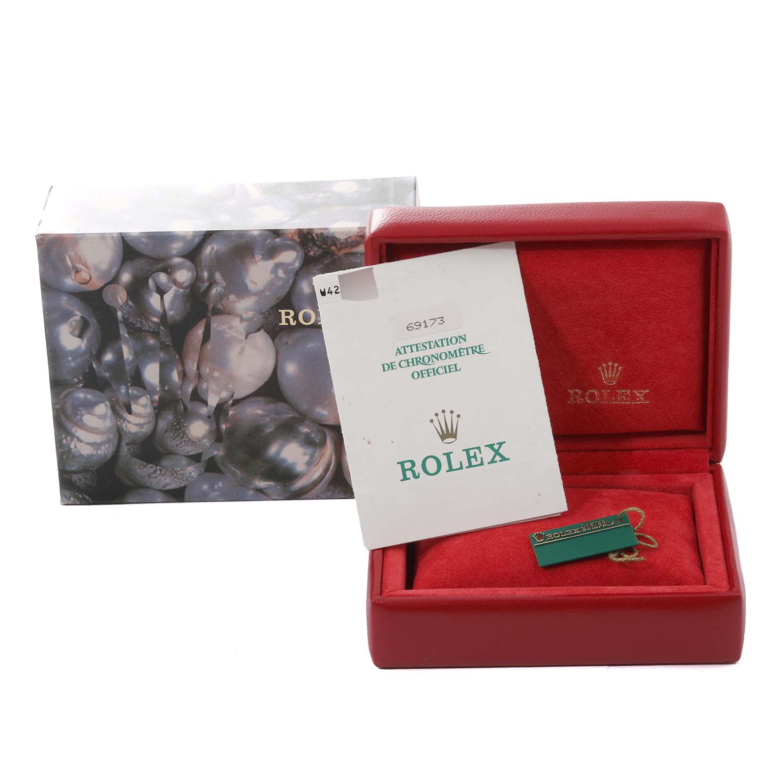 The image shows the packaging and certification for a Rolex Datejust 69173 Women's Steel and Gold (two tone) Blue Dial 69173 Women's Steel and Gold (two tone) Blue Dial, including a box, booklet, and tag.