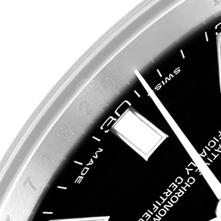 This close-up image shows the side of the dial and part of the bezel of a Rolex Datejust 116300 Men's Stainless Steel Black Dial 116300 Men's Stainless Steel Black Dial watch, featuring the "SWISS MADE" marking.