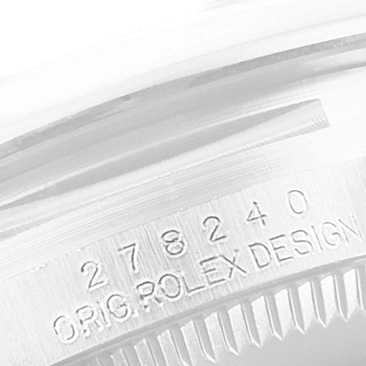 The image shows a close-up angle of the inner bezel of a mid-size Rolex watch with the serial number and "ORIG. ROLEX DESIGN" engraved.
