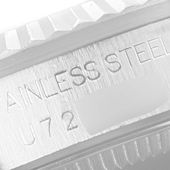 This image shows an angled view of the side of a Rolex Mid-Size 68274 Women
s Stainless Steel Silver Dial 68274 Women
s Stainless Steel Silver Dial watch, focusing on the engraved "STAINLESS STEEL" text.
