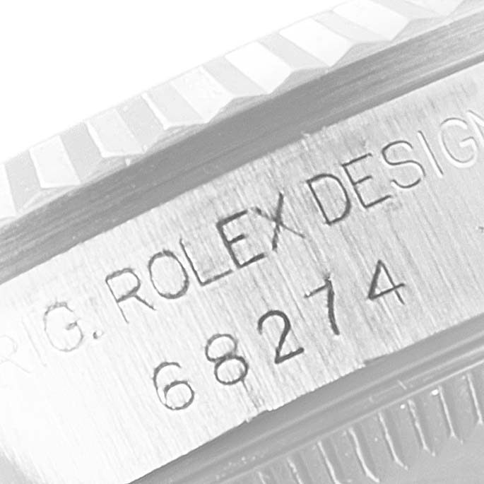 The image shows the side angle of a Mid-Size Rolex watch case, displaying the model number 68274 and "ROLEX DESIGN" engraving.