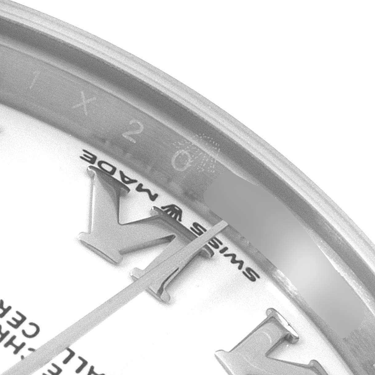 This close-up image shows the dial and part of the rehaut of a Mid-Size Rolex watch.