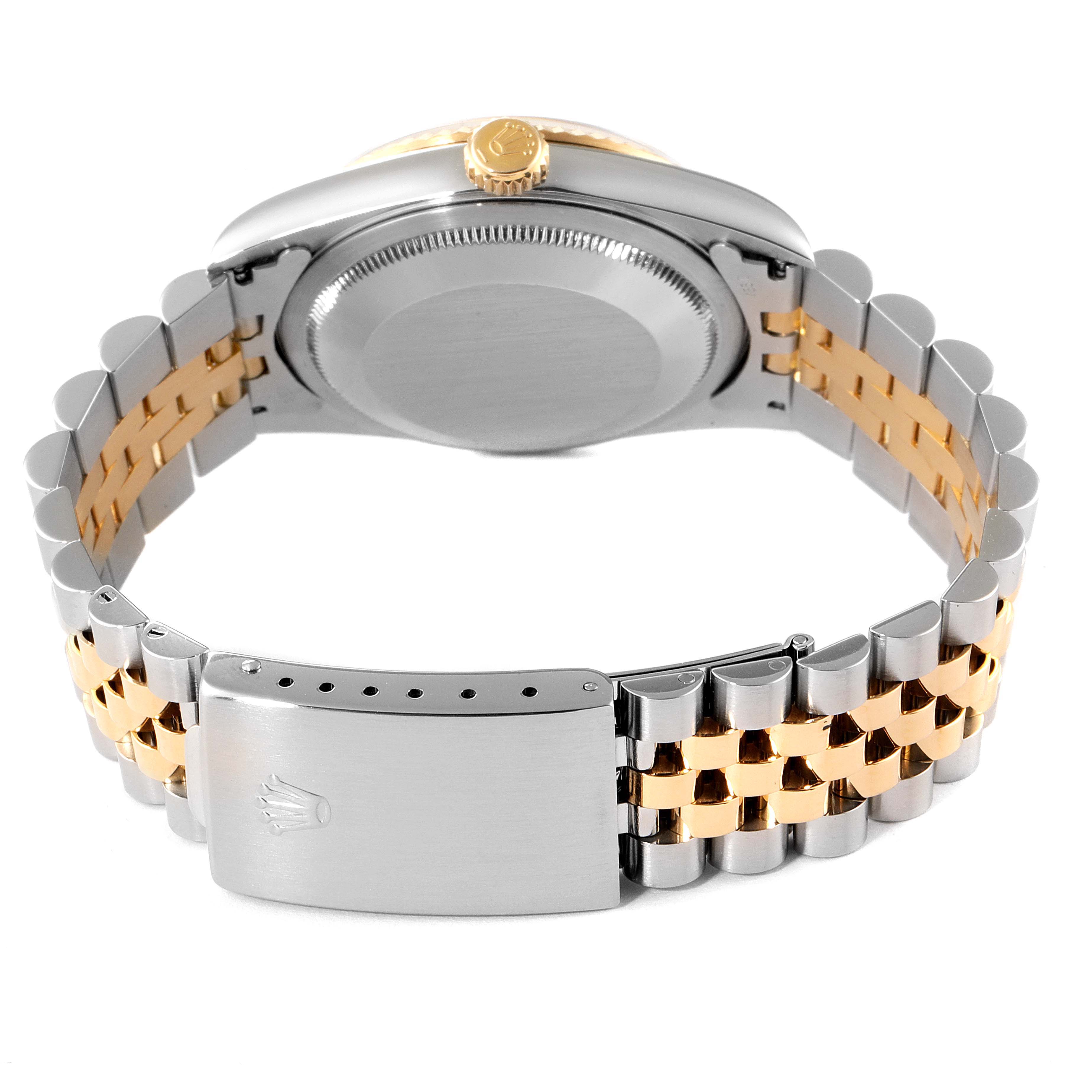 This image shows the case back, crown, and bracelet clasp of a Rolex Datejust 16233 Men's Steel and Gold (two tone) Black Dial 16233 Men's Steel and Gold (two tone) Black Dial watch.