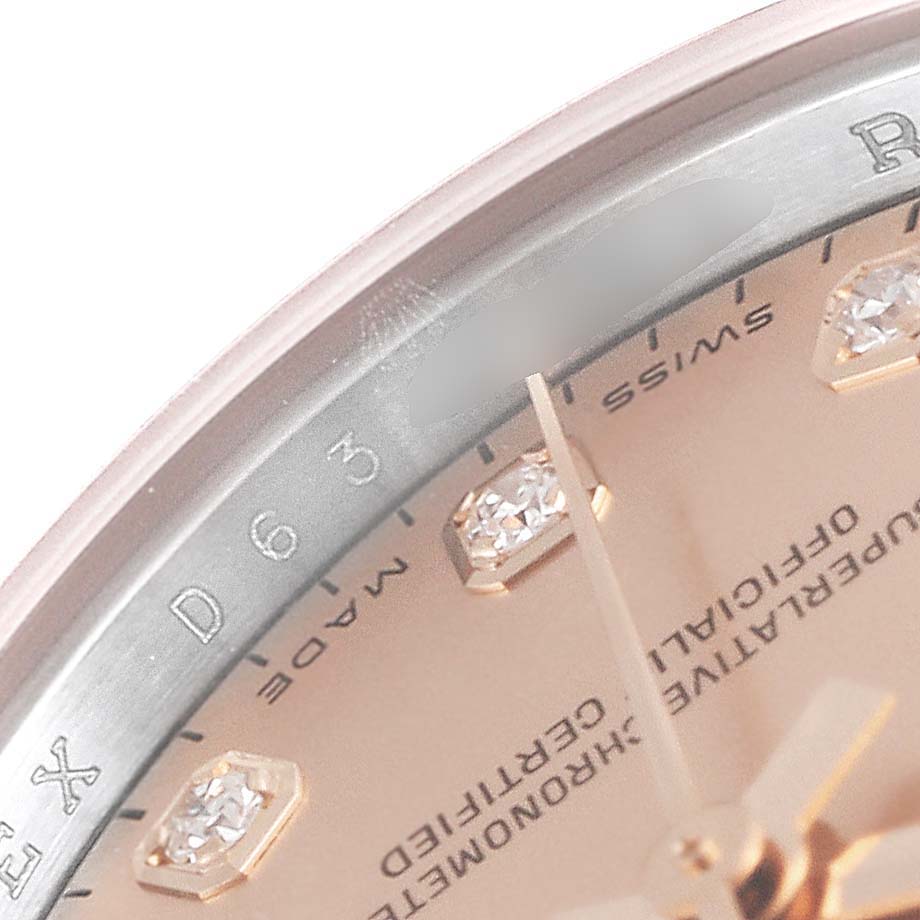 This image provides a close-up of the dial and bezel of a Rolex Datejust 179161 Women's Rose Gold Pink Dial 179161 Women's Rose Gold Pink Dial watch, highlighting the diamond hour markers.