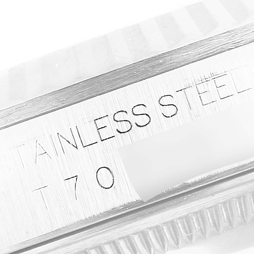 This close-up image shows the engraved text on the stainless steel part of a Rolex Datejust 16234 Men's Stainless Steel Silver Dial 16234 Men's Stainless Steel Silver Dial watch.