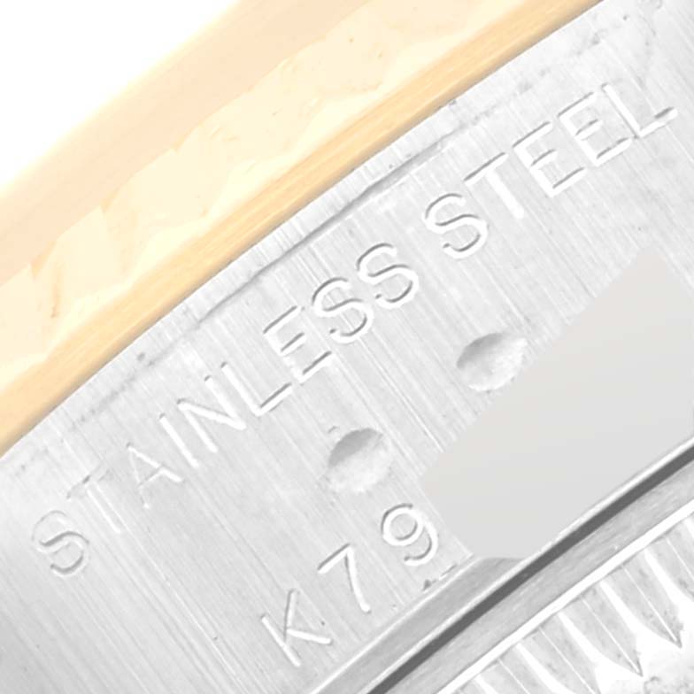 This close-up image shows the engraved "Stainless Steel" detail on the casing of a Rolex Datejust 79173 Women's Steel and Gold (two tone) Champagne Dial 79173 Women's Steel and Gold (two tone) Champagne Dial watch.