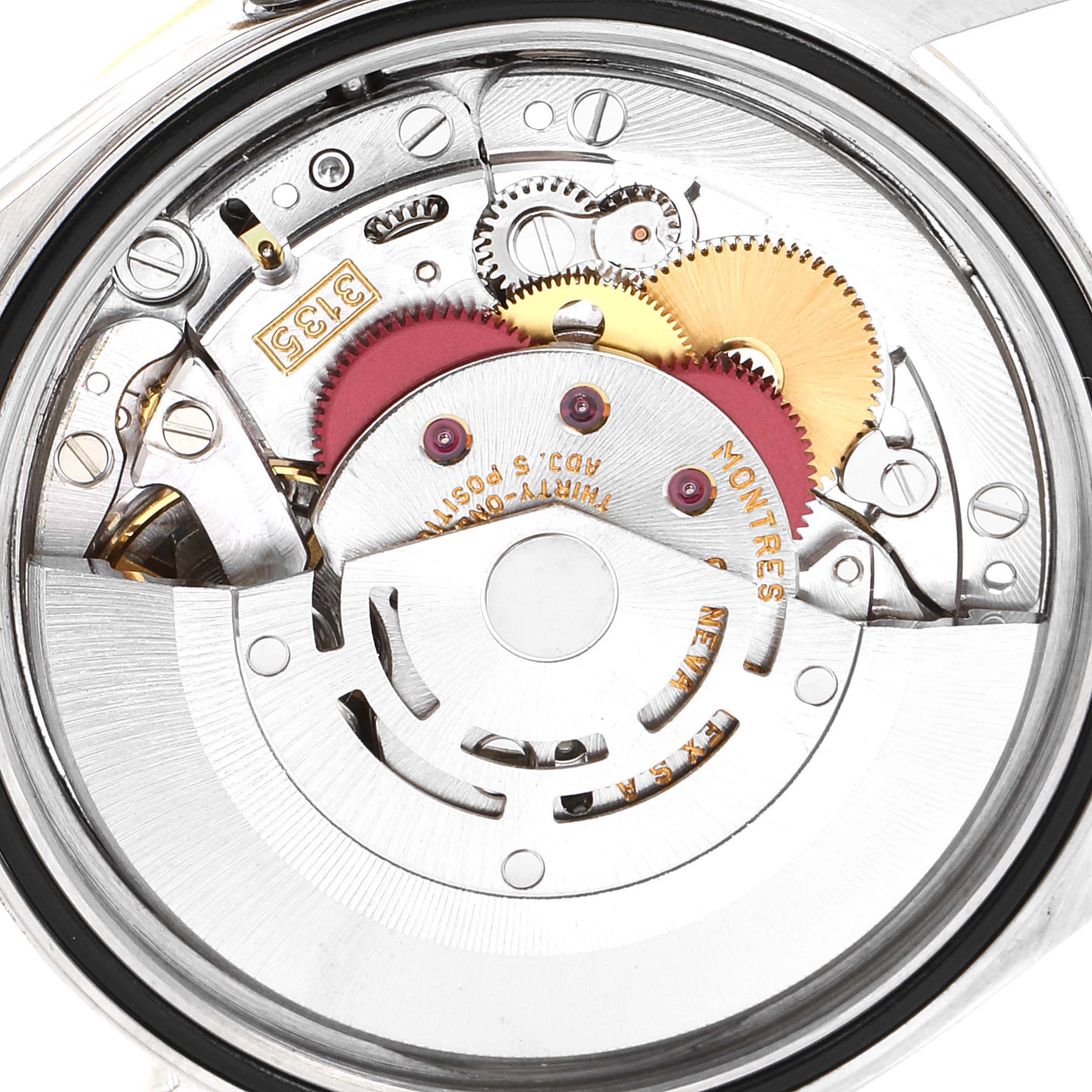 This image shows the internal mechanism of a Rolex Datejust 16233 Men's Steel and Gold (two tone) Champagne Dial 16233 Men's Steel and Gold (two tone) Champagne Dial watch, including gears and intricate components, viewed from the back.