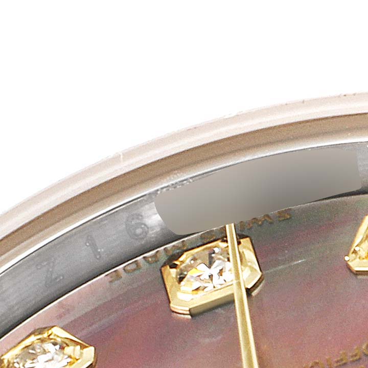 This image shows a close-up of the dial and diamond hour markers on the Rolex Datejust 179173 Women's Steel and Gold (two tone) Mother of Pearl Dial 179173 Women's Steel and Gold (two tone) Mother of Pearl Dial watch, focusing on the upper portion of the face.