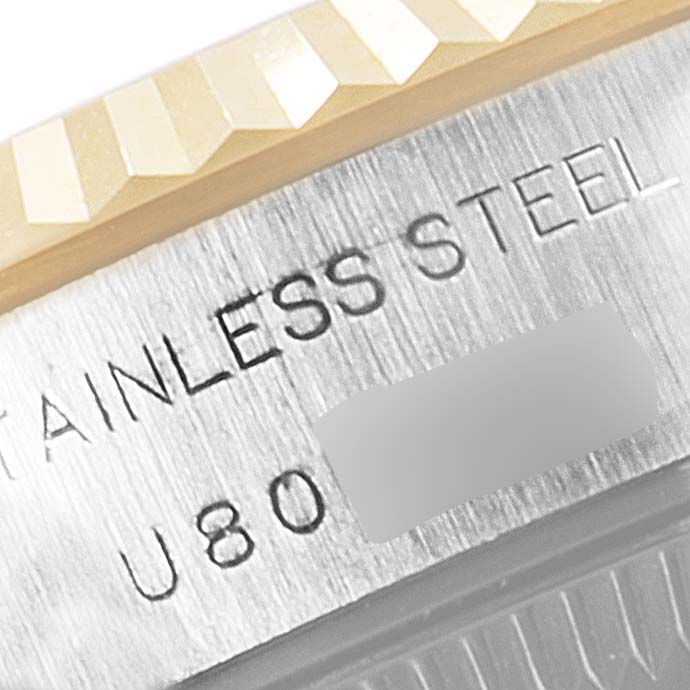 The image shows a close-up of the bezel and engraved stainless steel text of a Rolex Datejust 69173 Women's Steel and Gold (two tone) Grey Dial 69173 Women's Steel and Gold (two tone) Grey Dial watch.