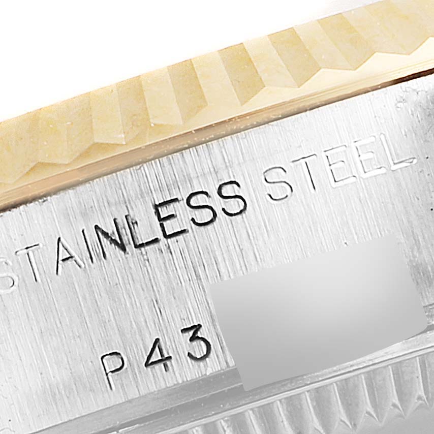 The image shows a close-up of the stainless steel case back and fluted bezel of a Rolex Datejust 79173 Women's Steel and Gold (two tone) White Dial 79173 Women's Steel and Gold (two tone) White Dial watch.