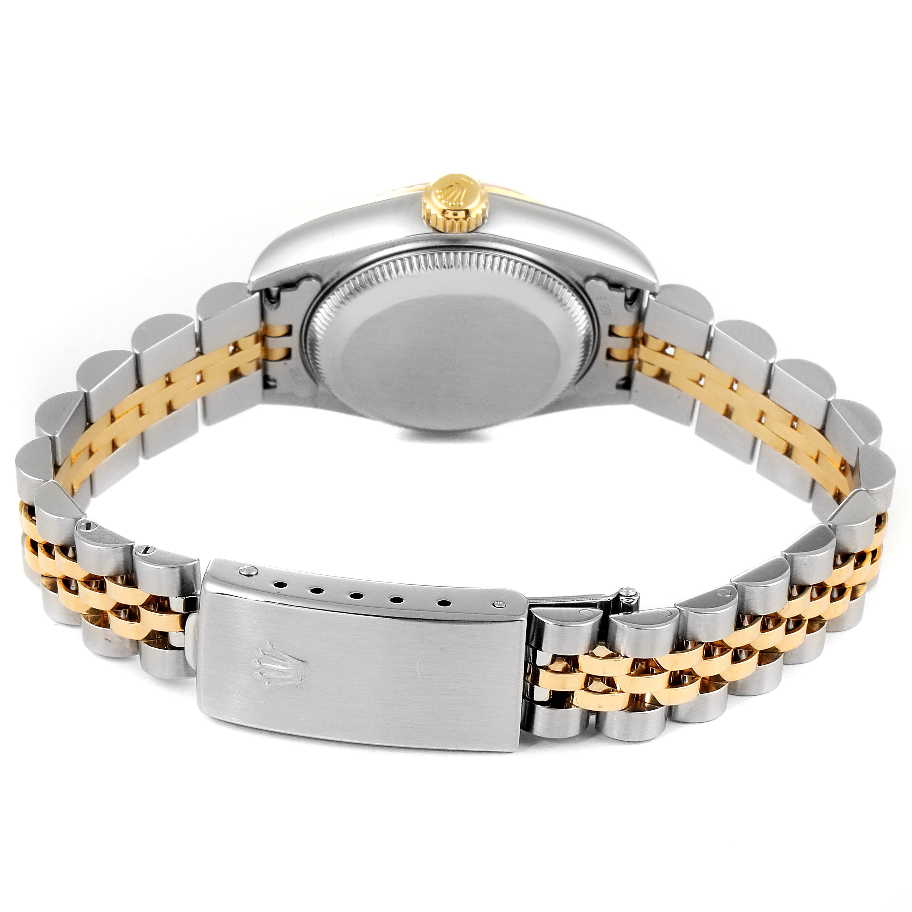 This image shows the backside of a Rolex Datejust 79173 Women's Steel and Gold (two tone) White Dial 79173 Women's Steel and Gold (two tone) White Dial, highlighting the clasp, case back, crown, and two-tone bracelet.
