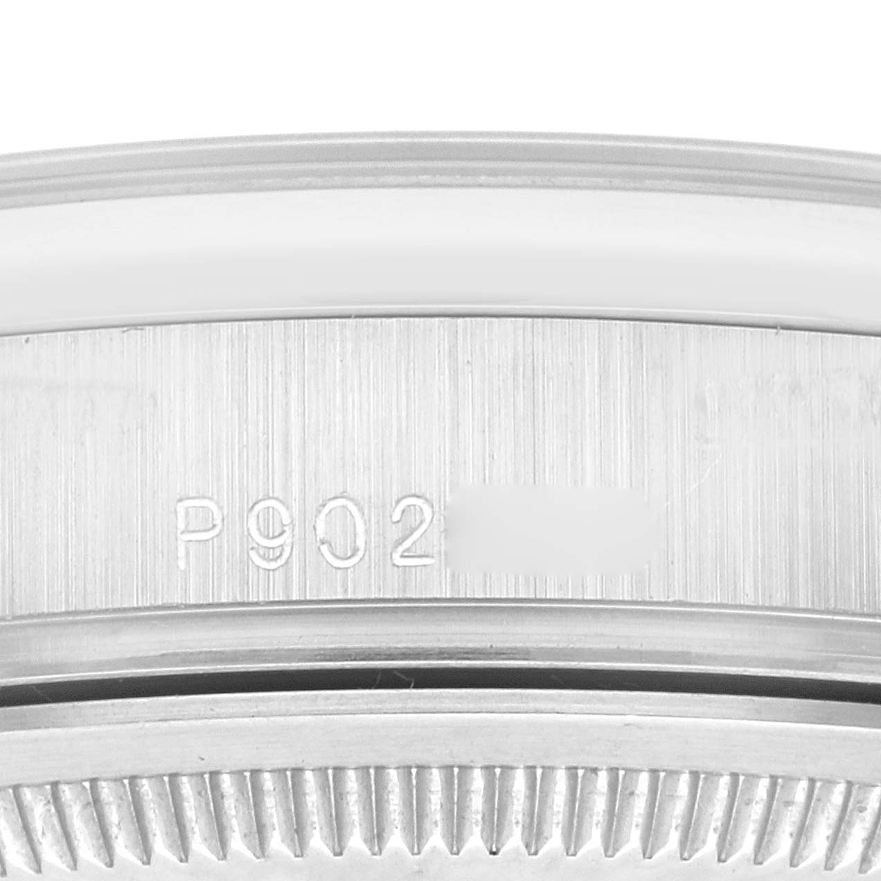 This image shows a close-up of the serial number engraved on the side of the case of a Rolex President 118206 Men's Platinum Silver Dial 118206 Men's Platinum Silver Dial model watch.