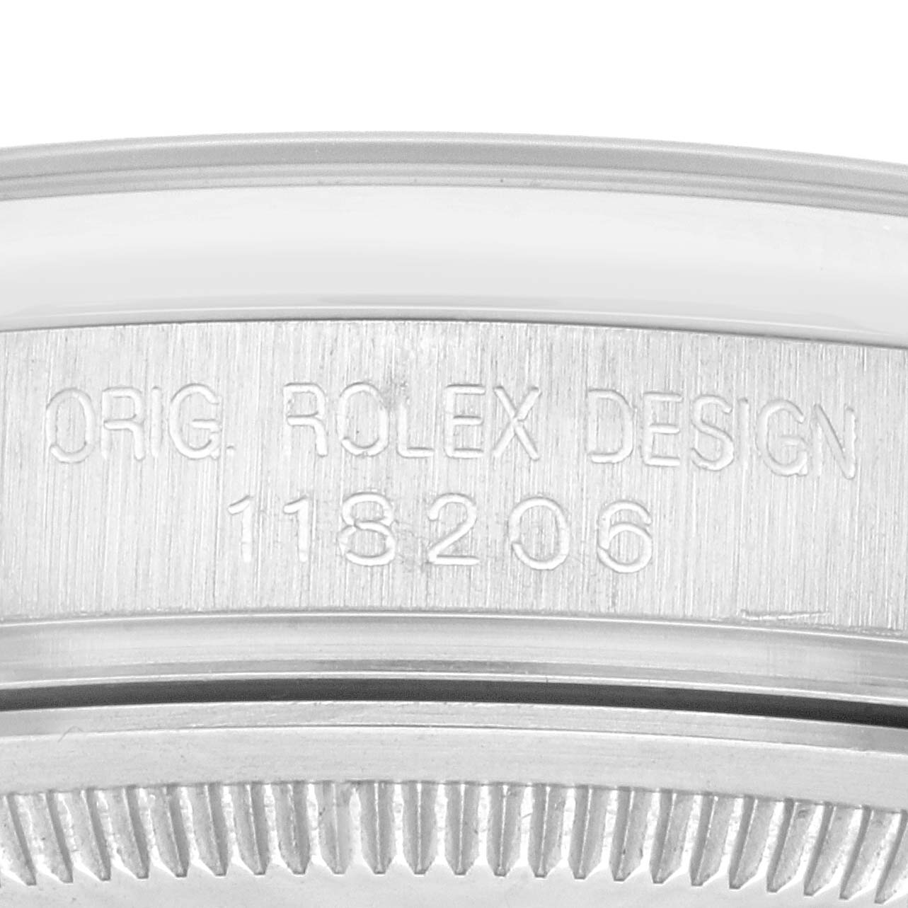 The image shows a close-up of the watch case with the "ORIG. ROLEX DESIGN 118206" engraving on the Rolex President 118206 Men's Platinum Silver Dial 118206 Men's Platinum Silver Dial model.