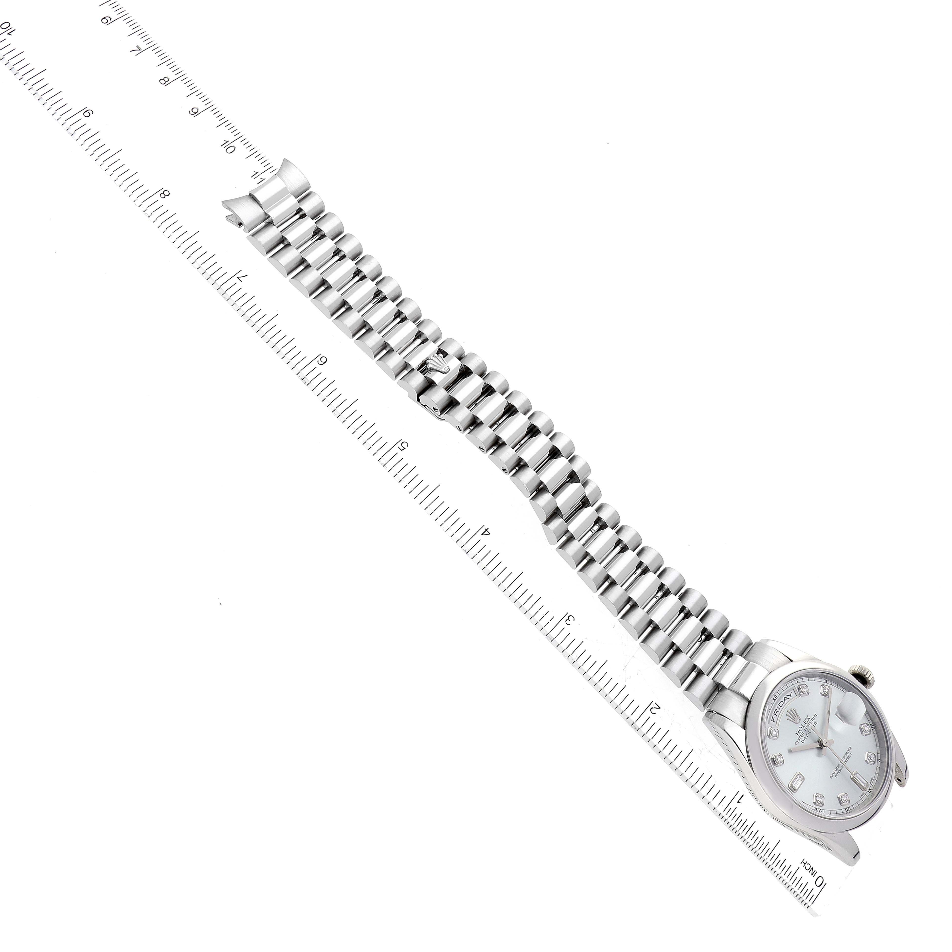 The image shows a top-down view of a Rolex President 118206 Men's Platinum Silver Dial 118206 Men's Platinum Silver Dial model watch with its case, dial, and bracelet displayed alongside a ruler.