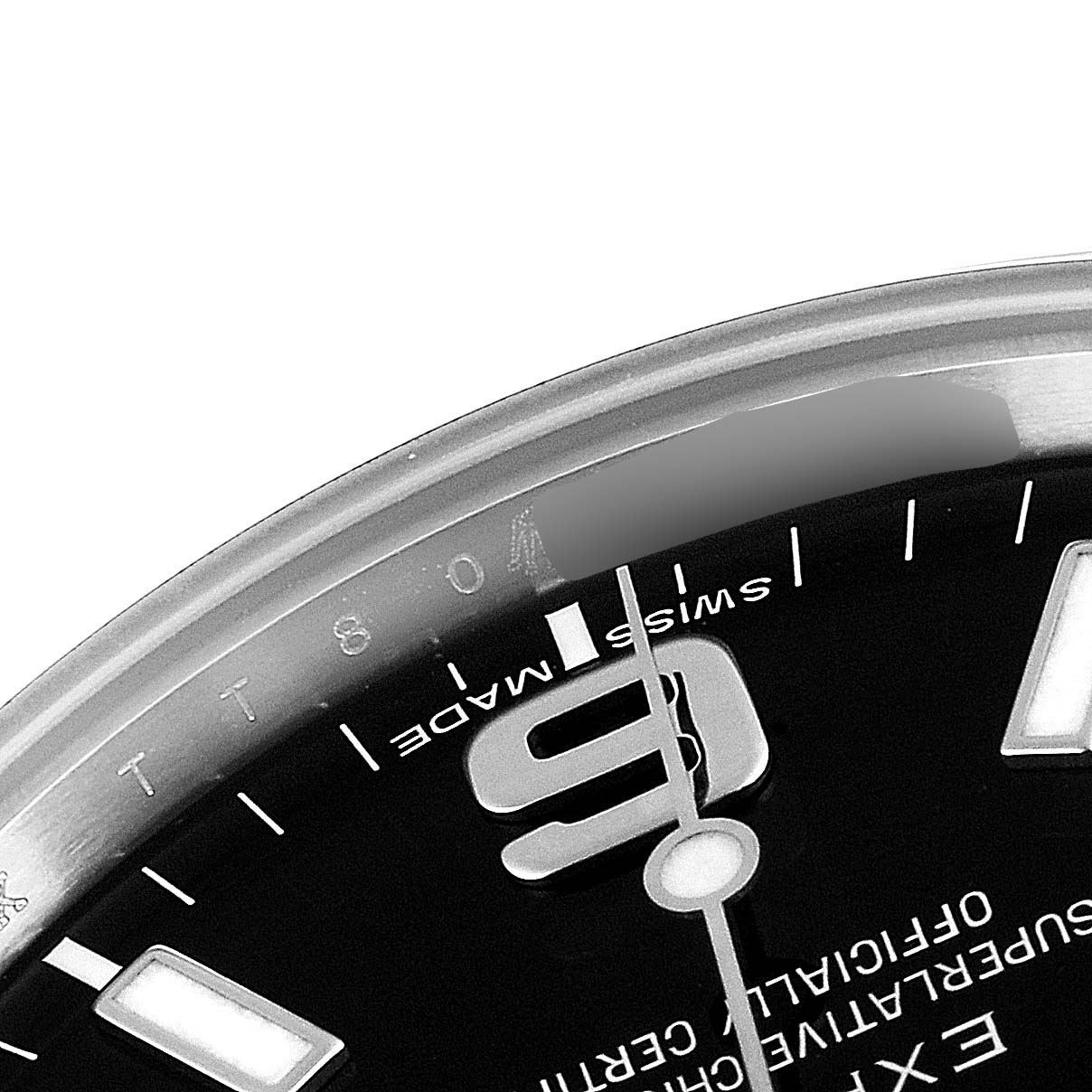 The image shows a close-up of the dial of a Rolex Explorer 214270 Men
s Stainless Steel Black Dial 214270 Men
s Stainless Steel Black Dial watch, highlighting the 9-hour marker and part of the surrounding bezel.