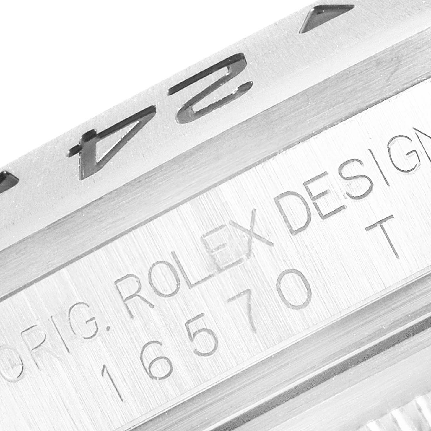 The image shows a close-up of the side engraving on the bezel and casing of a Rolex Explorer 16570 Men
s Stainless Steel Black Dial 16570 Men
s Stainless Steel Black Dial watch.