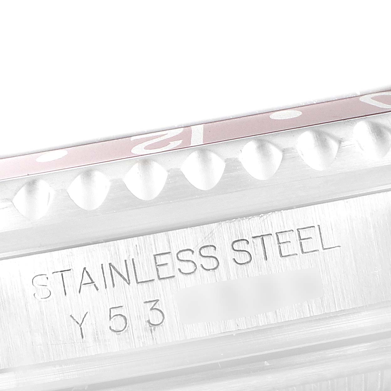 The image shows a close-up of the stainless steel case and part of the bezel edge of the Rolex GMT-Master 16710 Men's Stainless Steel Black Dial 16710 Men's Stainless Steel Black Dial watch.