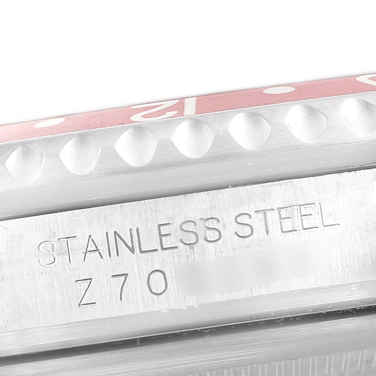 This image shows a close-up of the side view of a Rolex GMT-Master 16710 Men's Stainless Steel Black Dial 16710 Men's Stainless Steel Black Dial watch, highlighting the stainless steel material and part of the bezel.