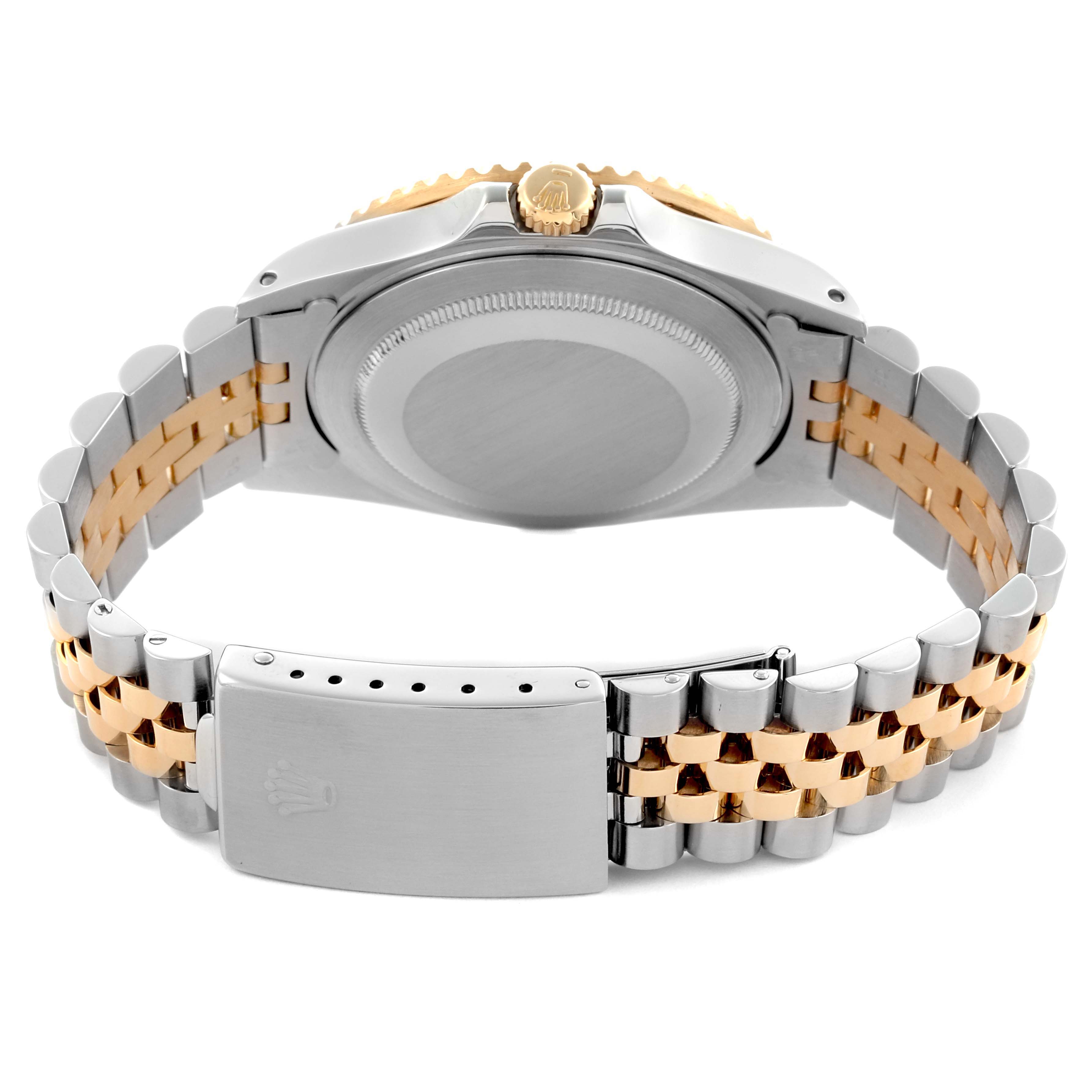 The image shows the Rolex GMT-Master 16713 Men's Steel and Gold (two tone) Black Dial 16713 Men's Steel and Gold (two tone) Black Dial's back case, crown, and two-tone bracelet viewed from the rear angle.