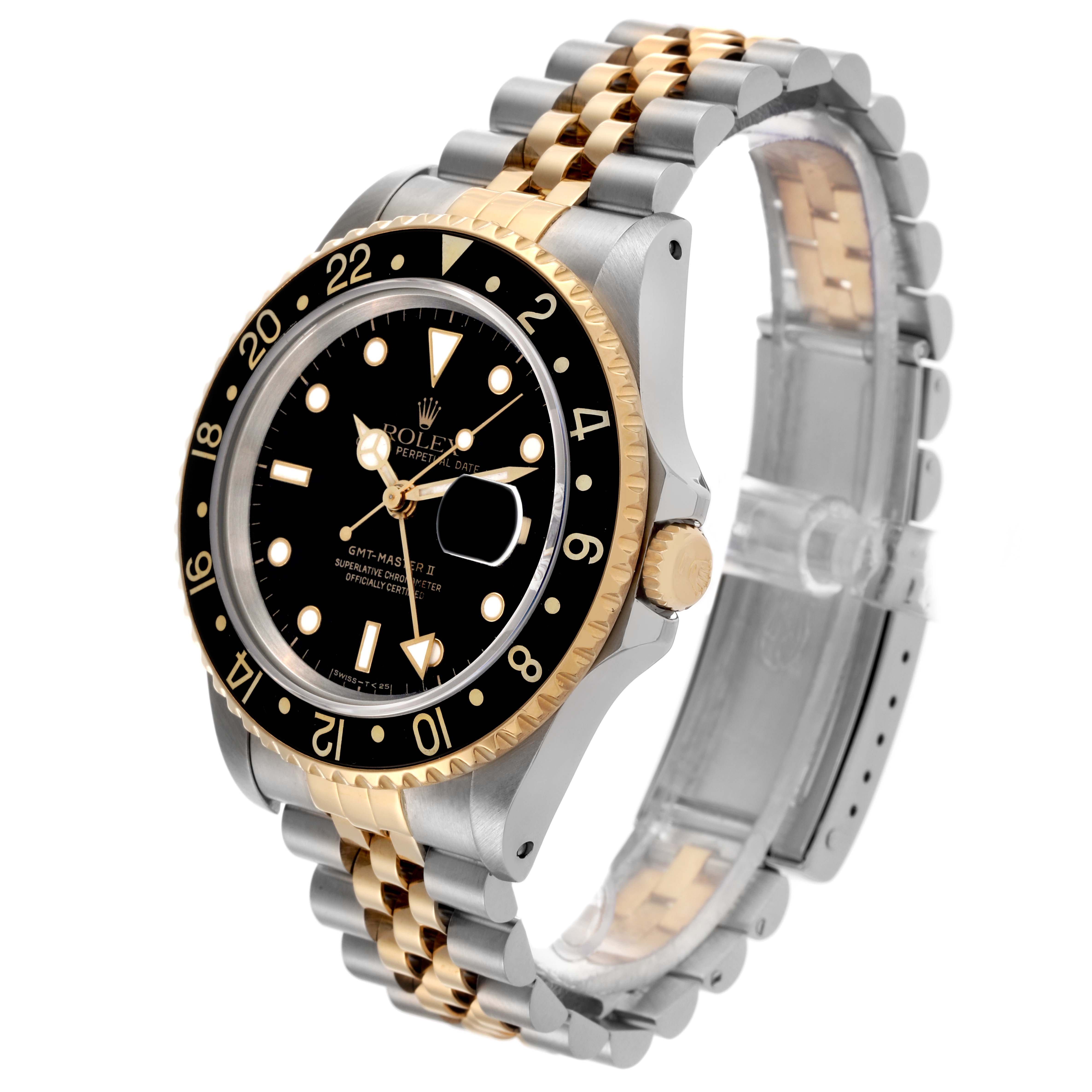 The Rolex GMT-Master 16713 Men's Steel and Gold (two tone) Black Dial 16713 Men's Steel and Gold (two tone) Black Dial watch is shown at a three-quarter angle, displaying the bezel, dial, crown, and jubilee bracelet.