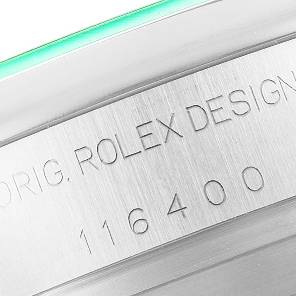 This close-up image shows the engraved serial number and the words "ORIG. ROLEX DESIGN" on the side of the Rolex Milgauss 116400GV Men's Stainless Steel Blue Dial 116400GV Men's Stainless Steel Blue Dial watch case.