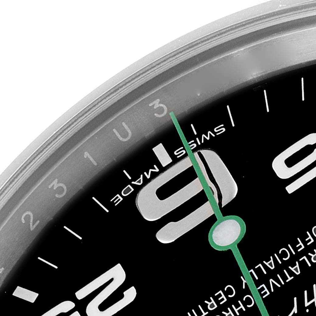 This close-up image shows the dial, minute and second markers, and the number 9 from the Rolex Air-King 116900 Men's Stainless Steel Black Dial 116900 Men's Stainless Steel Black Dial watch.
