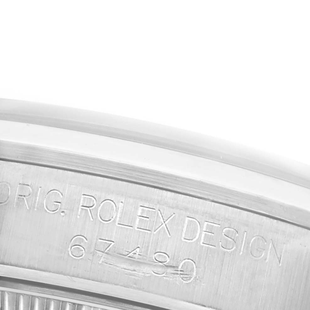 This image shows the side engraving of a Mid-Size Rolex watch, highlighting the model number "67480."