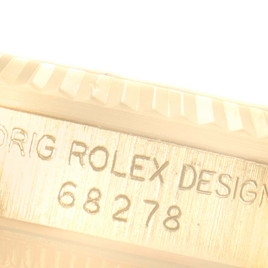 This close-up image shows the side casing and engravings of a Rolex President 68278 Women
s Yellow Gold Champagne Dial 68278 Women
s Yellow Gold Champagne Dial model watch.