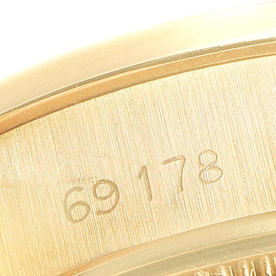 This close-up image shows the engraved case identification number on the side of a Rolex President 69178 Women's Yellow Gold Champagne Dial 69178 Women's Yellow Gold Champagne Dial model watch.