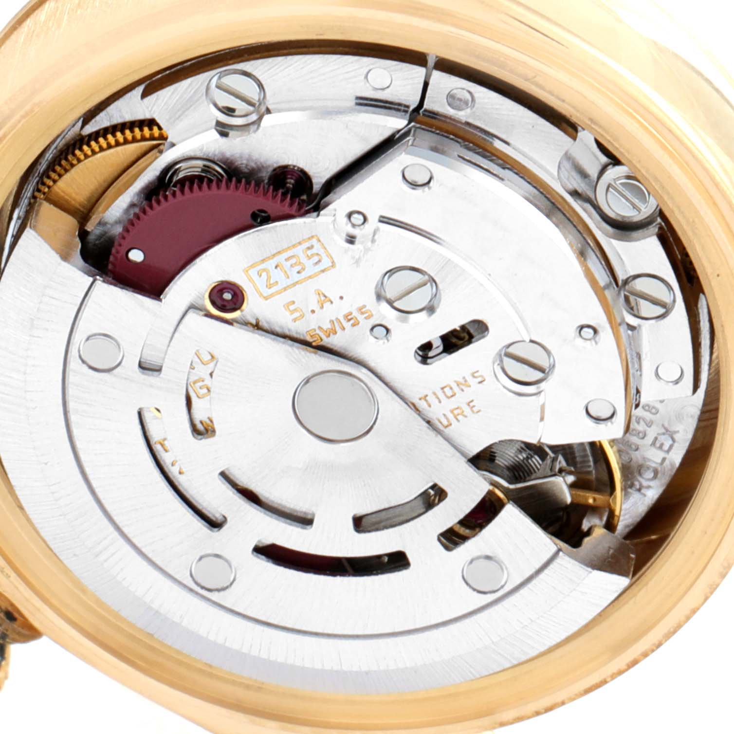 This close-up shot of a Rolex President 69178 Women's Yellow Gold Champagne Dial 69178 Women's Yellow Gold Champagne Dial watch displays its intricate internal movement components.