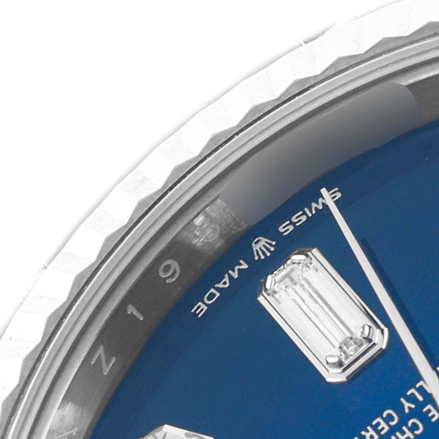 The image shows a close-up of the dial and bezel of a Rolex President 128239 Men's White Gold Blue Dial 128239 Men's White Gold Blue Dial watch, highlighting the "Swiss Made" text.