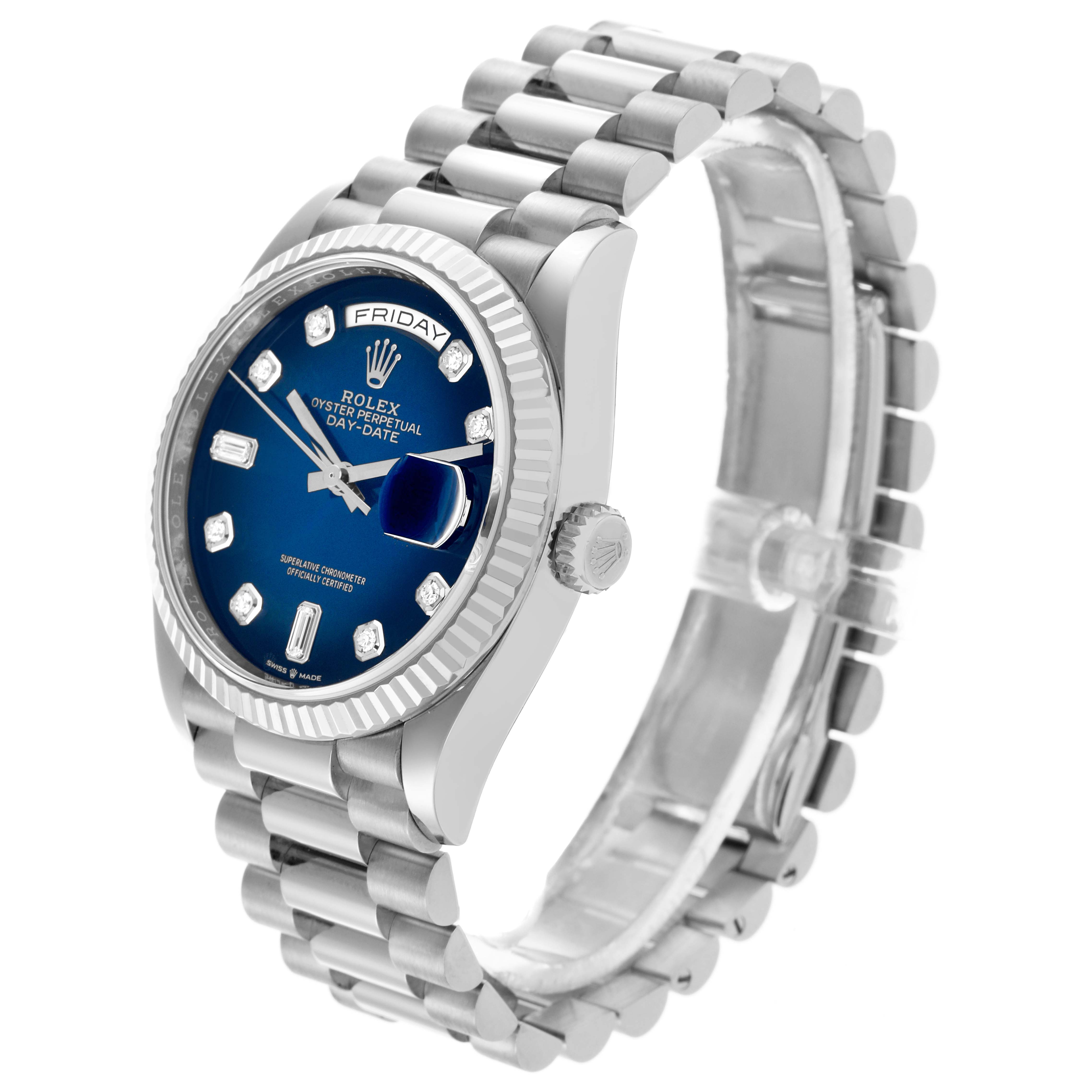 The Rolex President 128239 Men's White Gold Blue Dial 128239 Men's White Gold Blue Dial model is shown at a three-quarter angle, highlighting its blue dial, diamond hour markers, and fluted bezel.