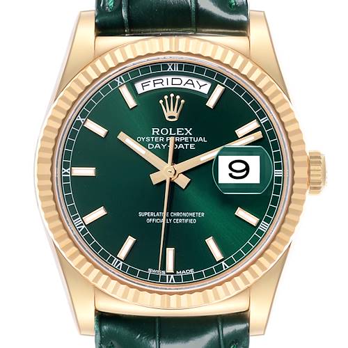 The Rolex President model is shown from the front, featuring a green dial, gold hour markers, fluted bezel, and a leather strap.