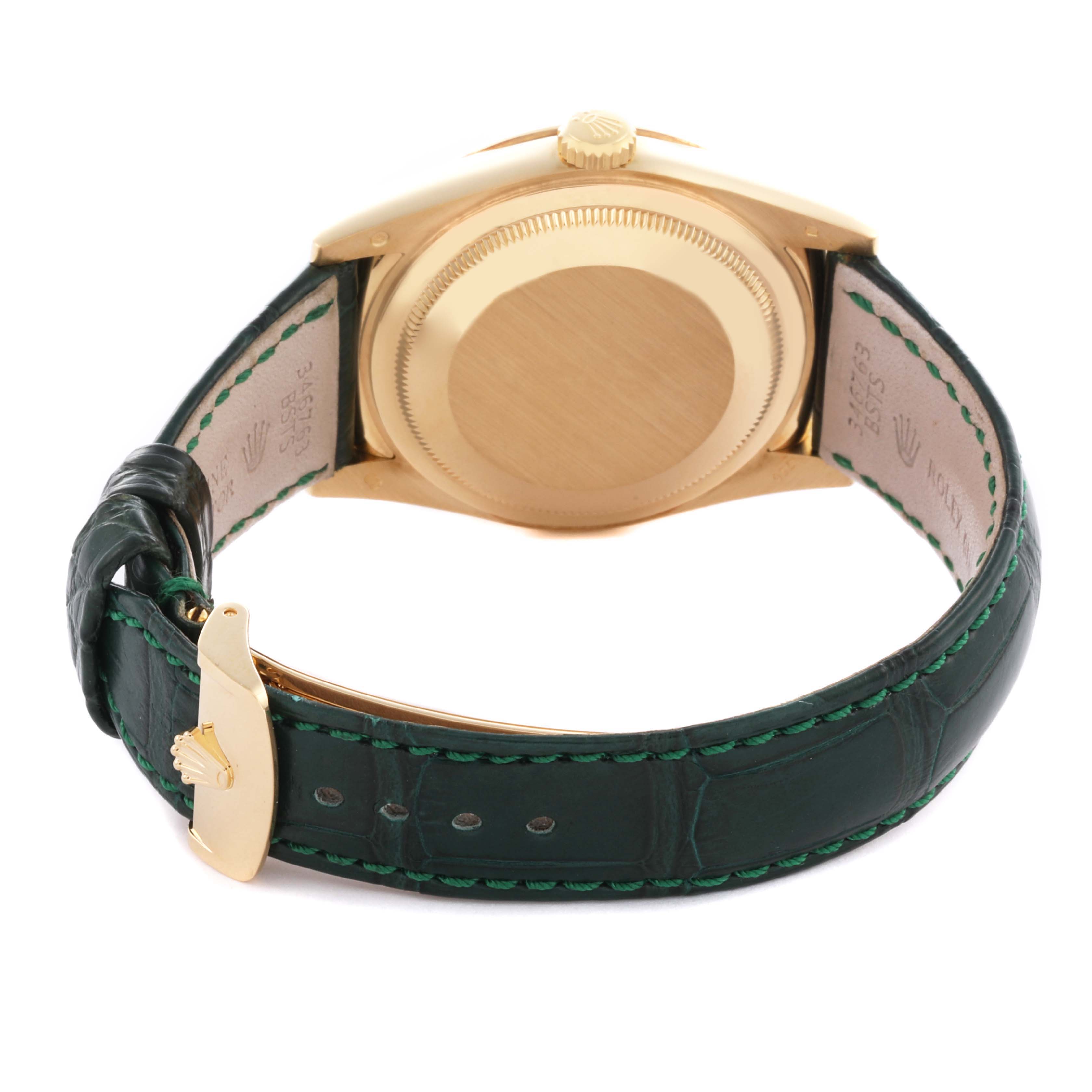 The Rolex President 118138 Men's Yellow Gold Green Dial 118138 Men's Yellow Gold Green Dial watch is shown from the back displaying the case, crown, and green leather strap with a buckle.