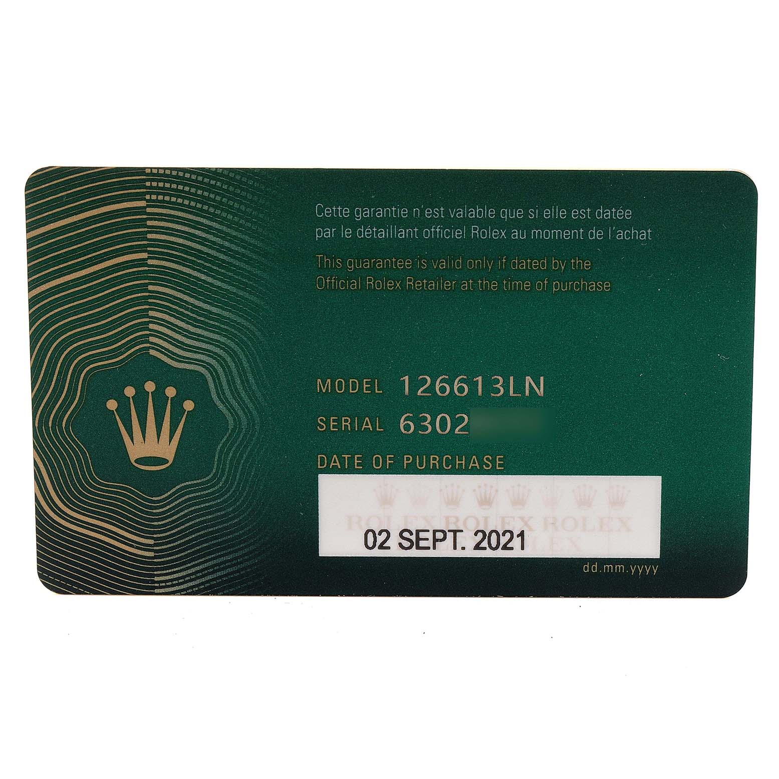 This image shows a close-up of a green Rolex guarantee card for the Rolex Submariner 126613 Men's Steel and Gold (two tone) Black Dial 126613 Men's Steel and Gold (two tone) Black Dial model 126613LN, displaying the serial number and purchase date.