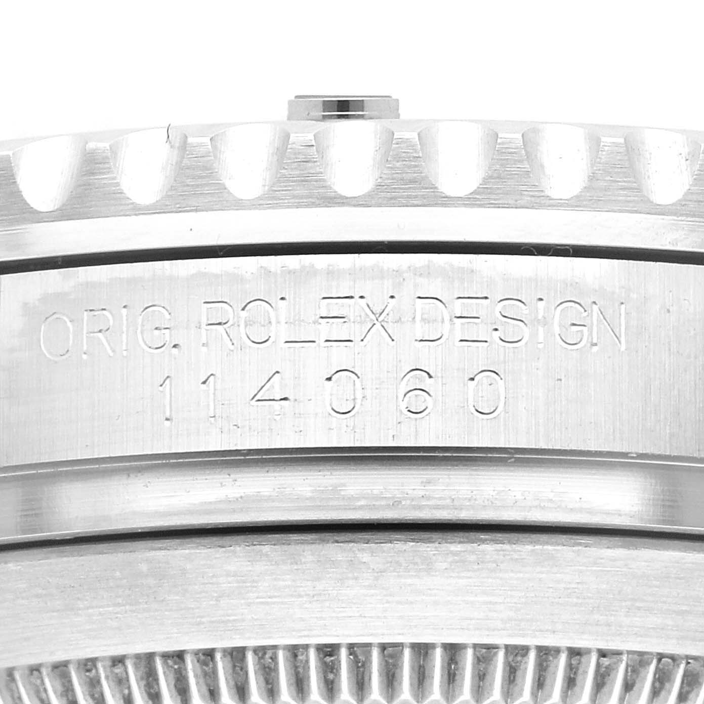 The image shows a close-up of the case side of a Rolex Submariner 114060 Men
s Stainless Steel Black Dial 114060 Men
s Stainless Steel Black Dial, displaying the model number and part of the bezel.