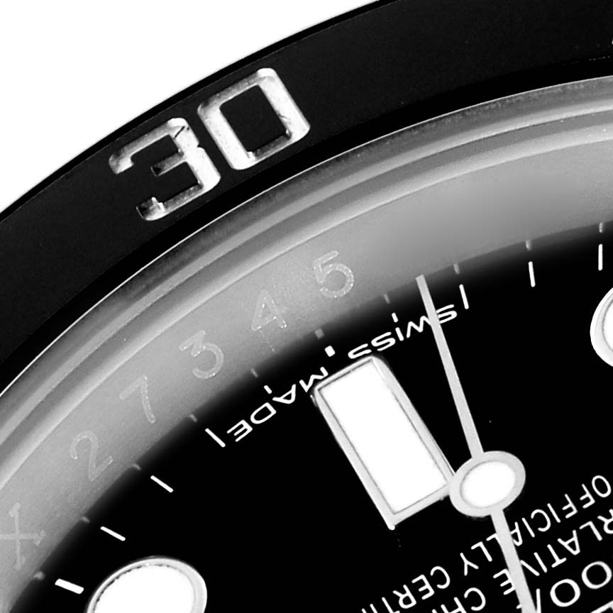 The image shows a close-up of the bezel and part of the dial of a Rolex Submariner 114060 Men
s Stainless Steel Black Dial 114060 Men
s Stainless Steel Black Dial watch, including the "30" marker.