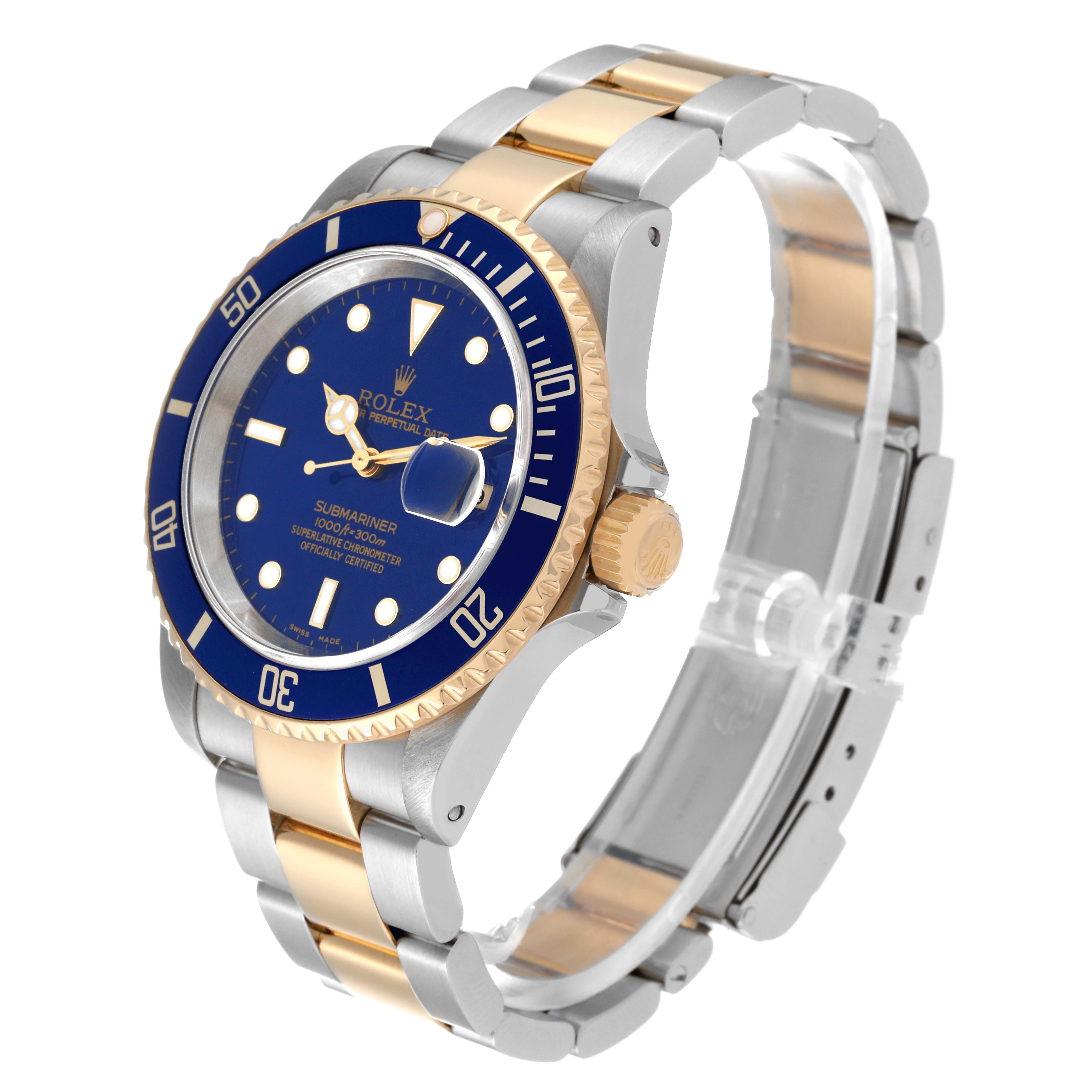 The image shows a Rolex Submariner 16613 Men's Steel and Gold (two tone) Blue Dial 16613 Men's Steel and Gold (two tone) Blue Dial watch at an angle, displaying its blue dial, gold bezel, and two-tone metal bracelet.