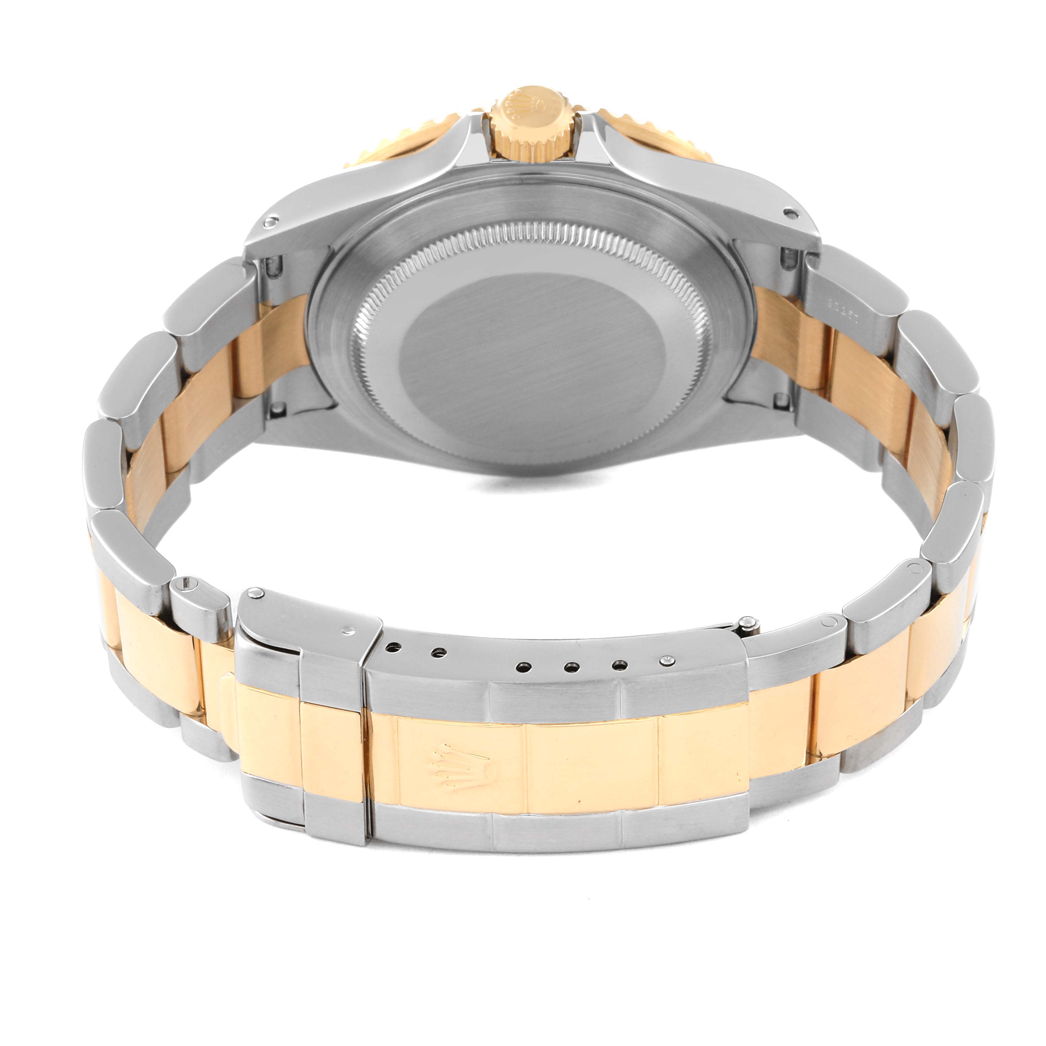 The image shows the back view of a Rolex Submariner 16613 Men's Steel and Gold (two tone) Blue Dial 16613 Men's Steel and Gold (two tone) Blue Dial watch, featuring its case back and two-tone metal bracelet.