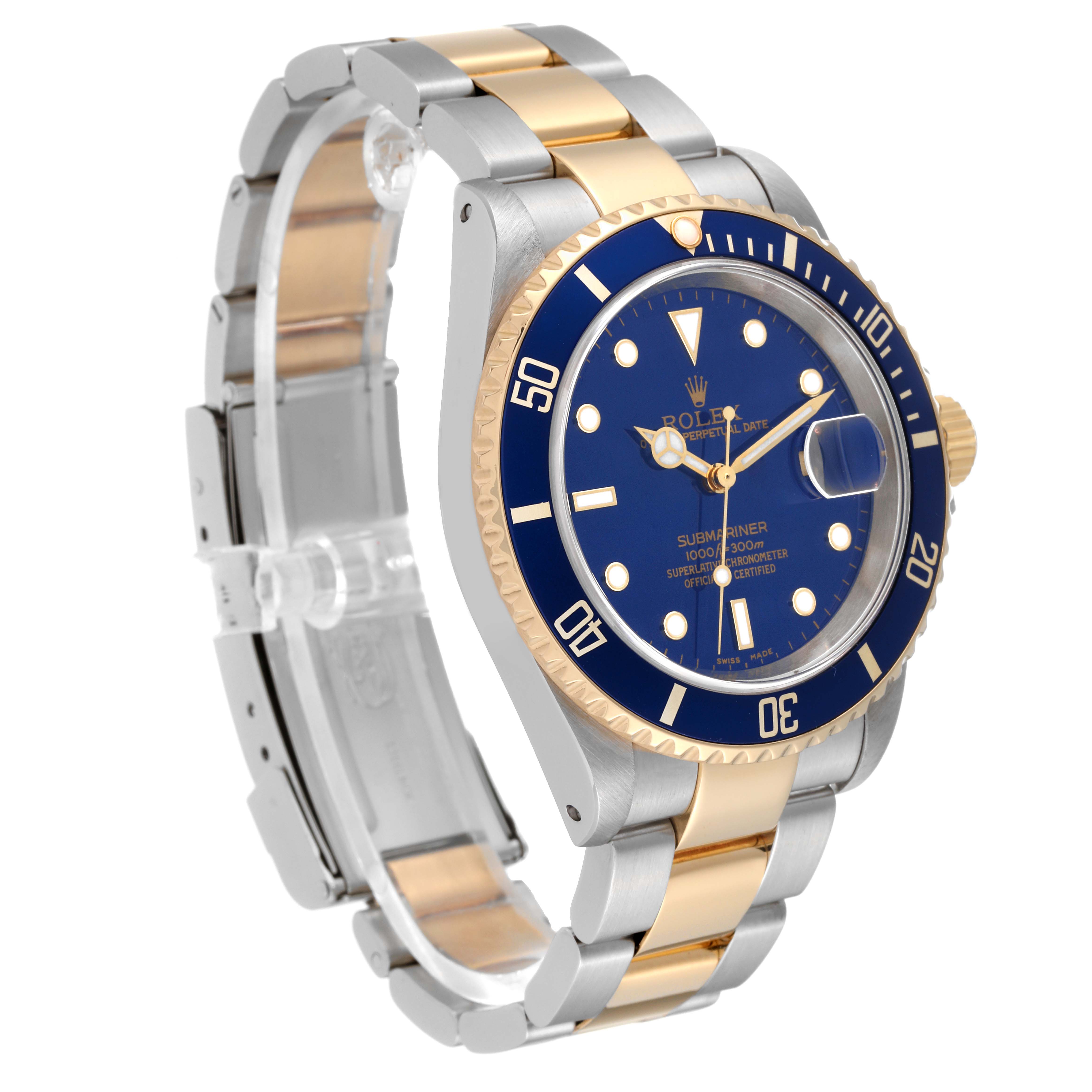 The image shows a Rolex Submariner 16613 Men's Steel and Gold (two tone) Blue Dial 16613 Men's Steel and Gold (two tone) Blue Dial watch at an angle highlighting its blue dial, bezel, and two-tone bracelet.