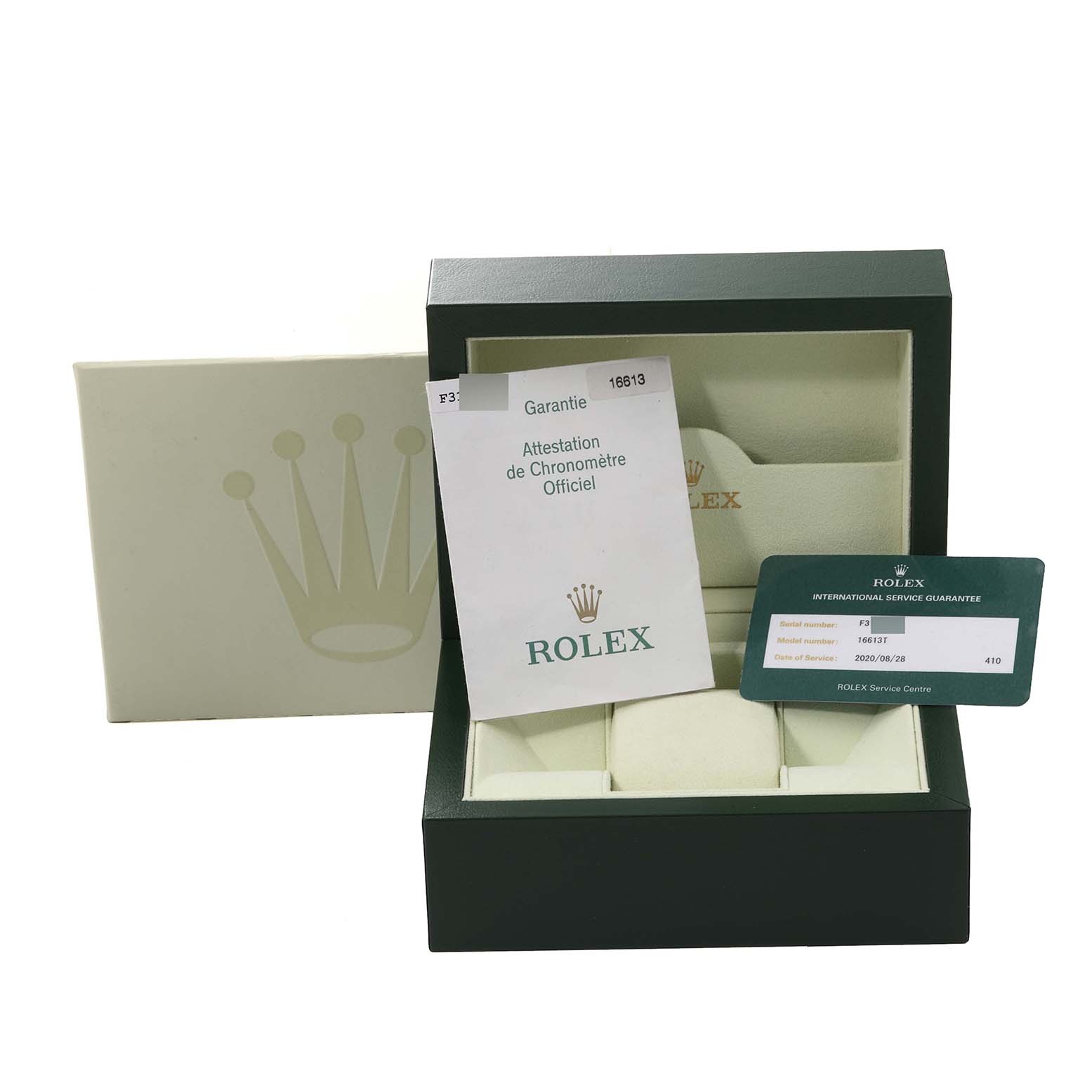 This image shows the packaging and documentation for a Rolex Submariner 16613T Men
s Steel and Gold (two tone) Blue Dial 16613T Men
s Steel and Gold (two tone) Blue Dial, including the box, warranty card, and official chronometer certificate.