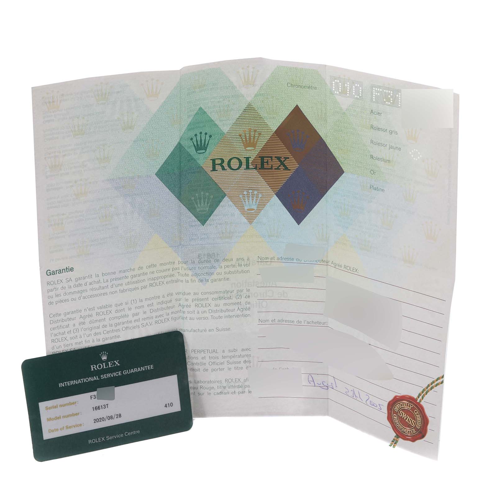 The image shows the guarantee certificate and service card for a Rolex Submariner 16613T Men
s Steel and Gold (two tone) Blue Dial 16613T Men
s Steel and Gold (two tone) Blue Dial watch.