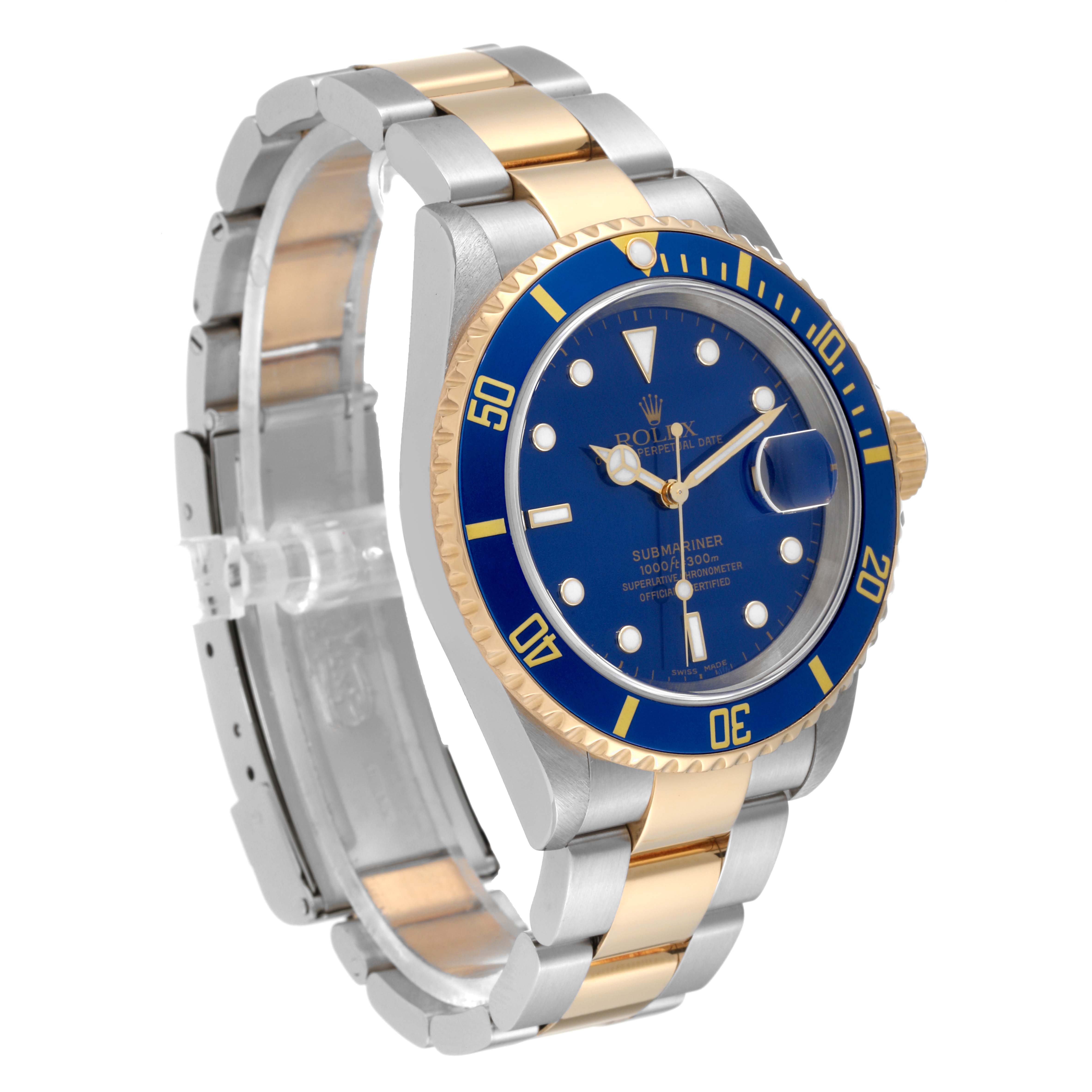 This image shows a Rolex Submariner 16613T Men
s Steel and Gold (two tone) Blue Dial 16613T Men
s Steel and Gold (two tone) Blue Dial watch at a three-quarter angle, featuring its blue dial, bezel, and two-tone bracelet.