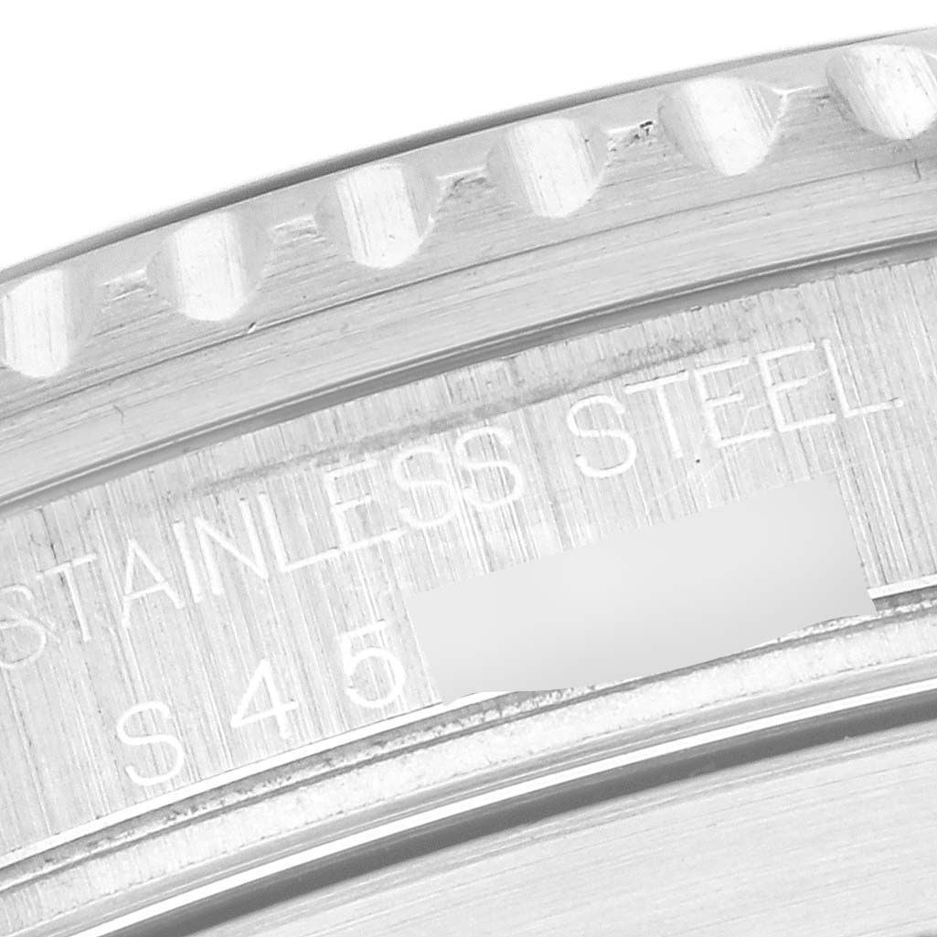 The image shows a close-up of the stainless steel case back and edge of a Rolex Submariner 16610 Men's Stainless Steel Black Dial 16610 Men's Stainless Steel Black Dial watch, highlighting the engraved text.