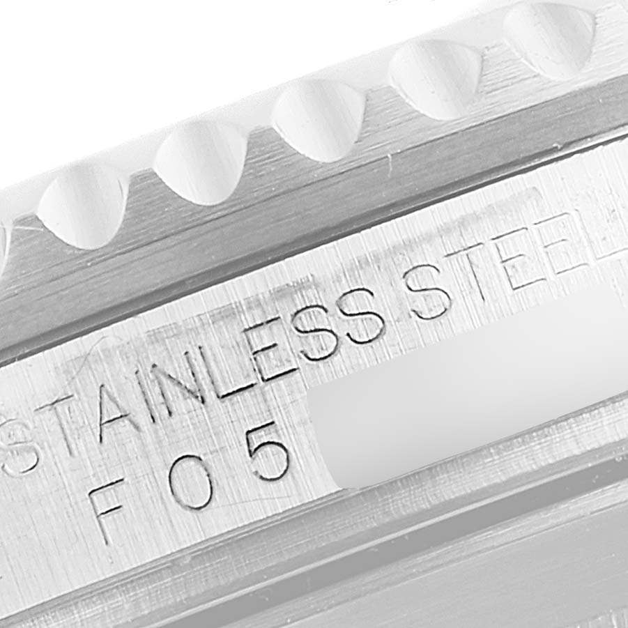 The image shows a close-up of the caseback engraving and part of the bezel of a Rolex Submariner 16610LV Men's Stainless Steel Black Dial 16610LV Men's Stainless Steel Black Dial watch.