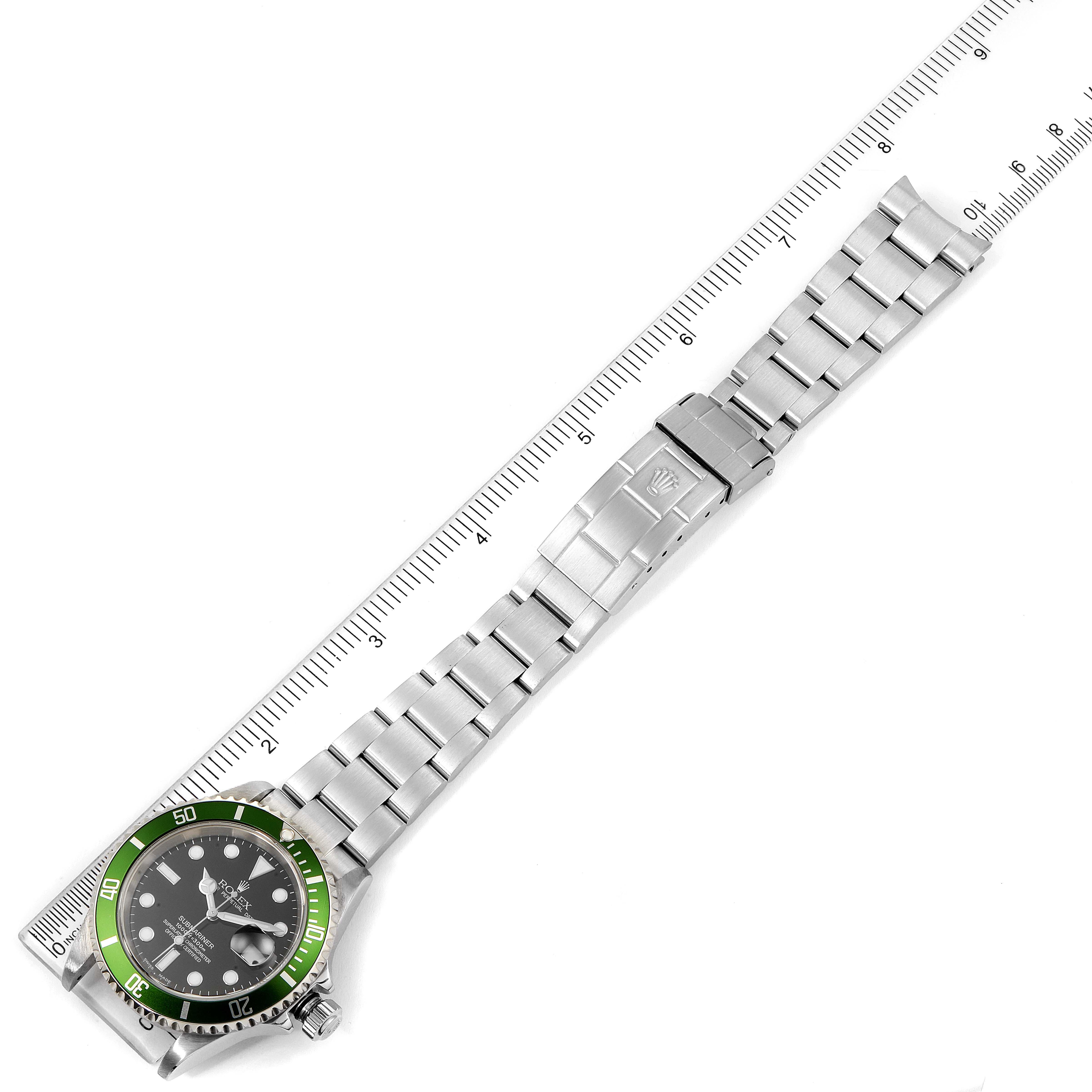 The image shows a top-down view of a Rolex Submariner 16610LV Men's Stainless Steel Black Dial 16610LV Men's Stainless Steel Black Dial watch, highlighting the dial, bezel, and full bracelet with a ruler for scale.