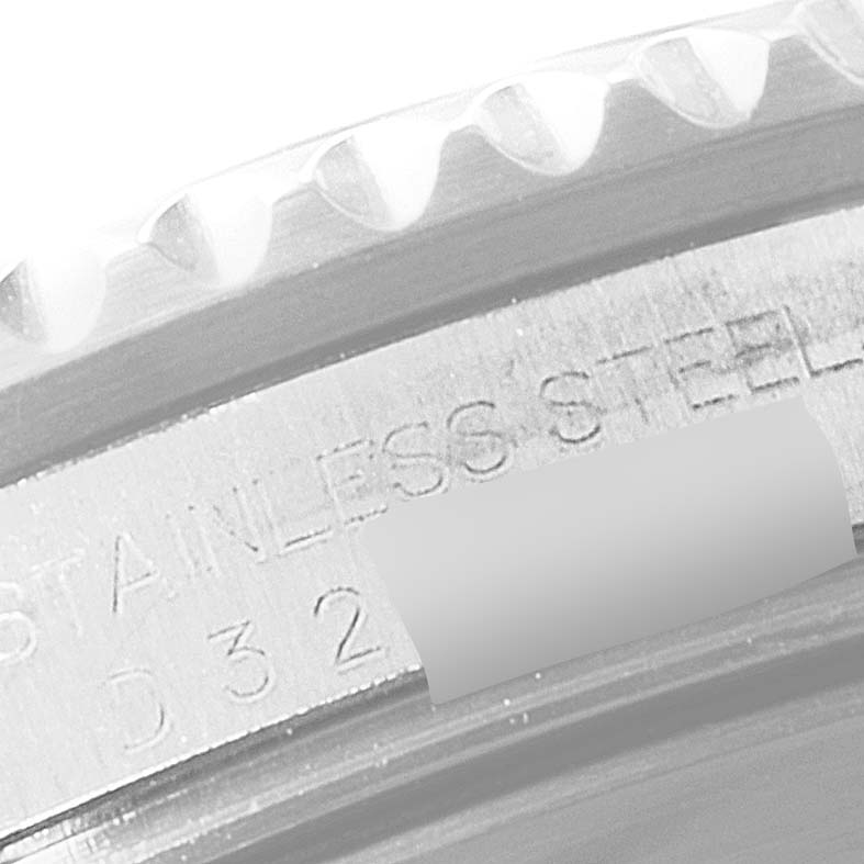This close-up image shows the edge and serial number engraving on the case back of a Rolex Submariner 16610LV Men
s Stainless Steel Black Dial 16610LV Men
s Stainless Steel Black Dial watch.